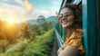 A happy smiling woman looks out from window traveling by train in Sri Lank, most picturesque train road in Sri Lanka	