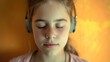 A teenage girl with auditory processing disorder listens intently to music her love for melodies and rhythms transcending her challenges.