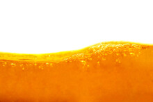 The Surface Of The Orange Water Ripples Looks Like Orange Juice, Beer, And Oil On White Background. Isolated