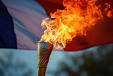 Fototapeta  - Flaming torch in front of the french flag