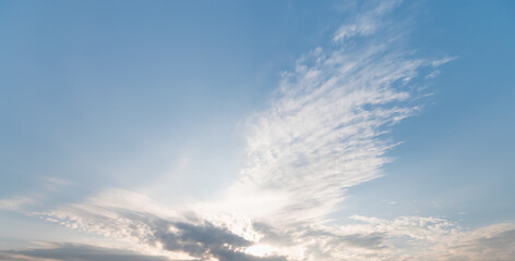 Poster - Blue sky and white clouds background - Pillowy clouds cover a blue sky in the background