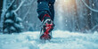 Winter exercise fitness lifestyle athlete walking with running shoes on snow in winter on icy sidewalks. Run outside doing sport in cold any weather healthy lifestyle keep moving concept