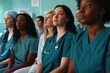 © primopiano - women with diverse skin tones wearing healthcare uniforms in a hospital