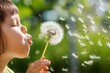 child blowing dandelion seeds in metropolitan garden