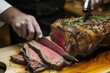 chef slicing a perfectly cooked prime rib on a carving board