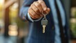 House keys handed to you by a salesperson, house purchase contract concept