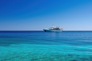 Wall Mural - Luxury yacht on clear blue tropical waters. Travel and leisure.
