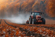 A farmer driving a tractor in a field 