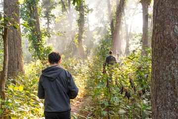 Men walking into the forest in Nepal incredible nature