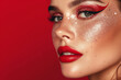 Close up view of a beautiful woman with red glitter on eye and red lipstick