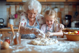 Fototapeta  - Happy grandmother with granddaughters baking buns on a  table in the kitchen