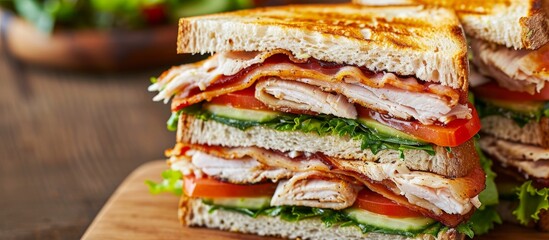 Canvas Print - Chicken breast, bacon, tomato, cucumber, and herbs in a club sandwich.