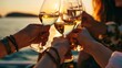 A clique of female friends cheers with goblets of white vino during sunset, close-up view.