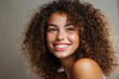 © vefimov - Smiling Woman with Curly Hair