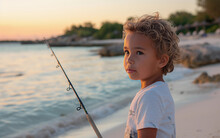 Little Girl Fishing On The Beach At Sunset