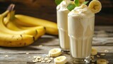 Fototapeta Do pokoju - Banana glass smoothie milkshake background with bananas