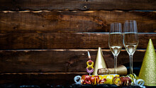 Solemn Background For The Anniversary With The Number  8. Happy Birthday Background On Brown Wooden Background With Champagne Bottle And Champagne Glasses. Beautiful Holiday Decorations Copy Space.