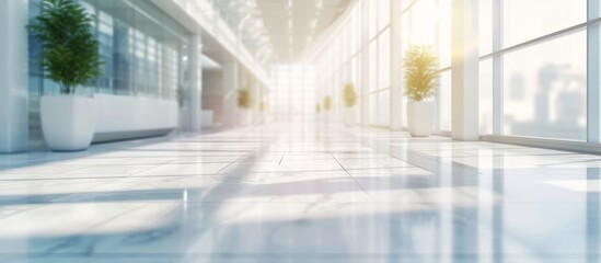 Poster - A blurry image of a well-lit, long hallway in an office building with numerous windows.