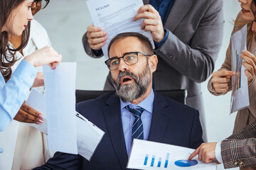 Shot of a mature businessman looking overwhelmed in a demanding work environment. Don't let the stress get the better of you. Shot of a mature businessman looking anxious