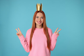 Canvas Print - Beautiful young woman with princess crown on light blue background