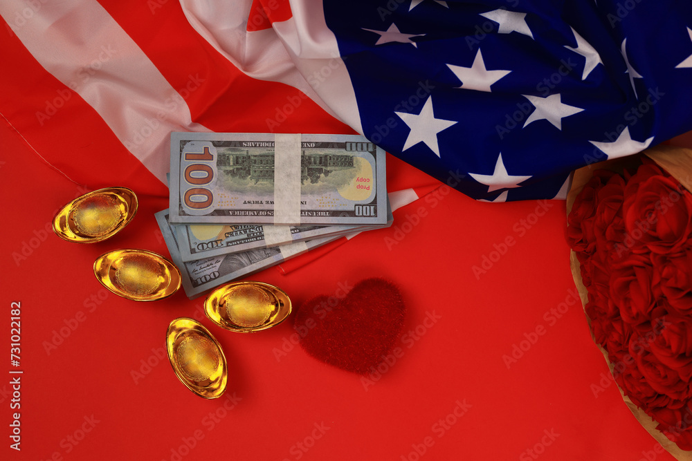 American flag with cash us dollar and golden ingot with heart shape in ...