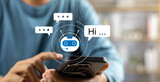 Fototapeta  - AI Artificial Intelligence,Digital chatbot, Man chatting with digital assistant chatbot on mobilephone on internet application,Future of customer service man utilizes AI chatbot for instant assistance