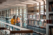 © Marko Geber - Female students reading in the college library together
