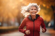 © pham - A woman wearing a red jacket runs energetically down a city street.