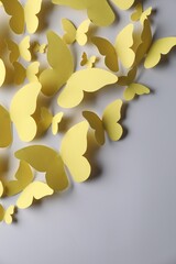 Sticker - Yellow paper butterflies on light grey background, top view. Space for text