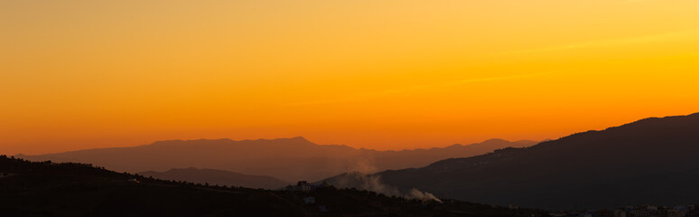 sunset view orange sky and mountains