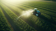 Tractor car spraying pesticides in soybean field during springtime
