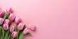 Bouquet of pink tulips on a pink background, top view, space for text. Generative AI