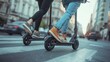 © cherezoff - Two people on electric scooters riding