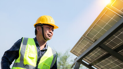 Engineers in helmets installing solar panel system outdoors. Concept of alternative and renewable energy. solar cell system, smart farming concept, Water system technology in solar energy agriculture.