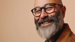 © iuricazac - Smiling man with gray beard and glasses wearing brown leather jacket against soft-focus beige background.