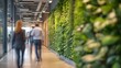 © TensorSpark - A modern, eco-friendly office environment promoting employee health, featuring a lush living green wall, natural light, and ergonomic furniture designed for comfort and productivity.