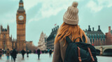 Fototapeta Big Ben - A female travelling looking Big Ben and The Houses of Parliament in London