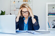 © okrasiuk - Shocked 50's mature businesswoman, middle-aged experienced female looking at documents in office. Accounting report. Frustrated worried face expression emotion feelings problem perception reaction.