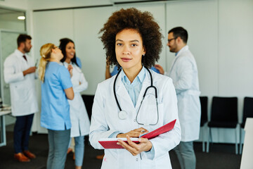 Wall Mural - doctor nurse portrait man hospital group team medical uniform health black african american smiling professional clinic medicine male happy female occupation teamwork care