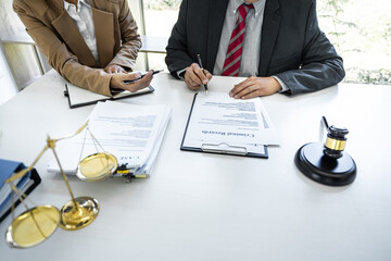 Wall Mural - Businesswoman and Male lawyer or judge consult having team meeting with client, Law and Legal services concept