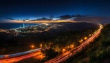 Fototapeta Miasto - traffic in the city long exposure by night, near the sea