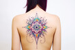 Mandala tattoo on skin. Colors mandala tattoo on back. Woman's tattoo, mandala. Mandala tattoo. Tattoo ideas for women. Tattoo ideas for men. Tattoo parlor. Tattoo artist profession.​