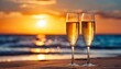 two glasses of champagne on sandy beach in beautiful sunset