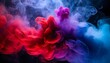 dramatic smoke and fog in contrasting vivid red blue and purple colors vivid and intense abstract background or wallpaper