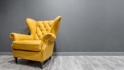 Wall Mural - yellow button tufted soft cushioned leather armchair on gray background interior design modern furniture concept banner with copy space