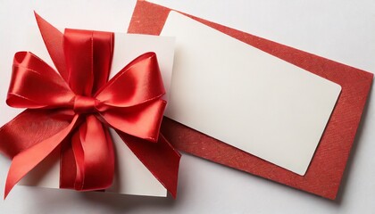 Wall Mural - blank gift card with red bow on white top view