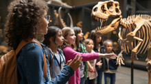 A Knowledgeable Teacher Guides A Group Of Curious Students Through A Captivating Museum, Unveiling The Wonders Of Art, Science, And History.