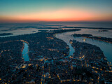 Fototapeta Nowy Jork - Aerial picture of Venice with famous illuminated landmarks and sunrise colours in the sky during morning blue hour
