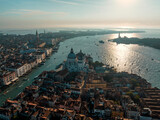 Fototapeta Nowy Jork - Aerial picture of Venice with famous landmarks San Marco square and Church of Santa Maria during morning golden hour