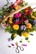Basket Of Nutritious Edible Flowers, Roses, Geranium, Hydrangea, Zucchini Squash, Nasturtium, And Plumbago, To Add Flavor, Texture And Color To Meals. Top Down.